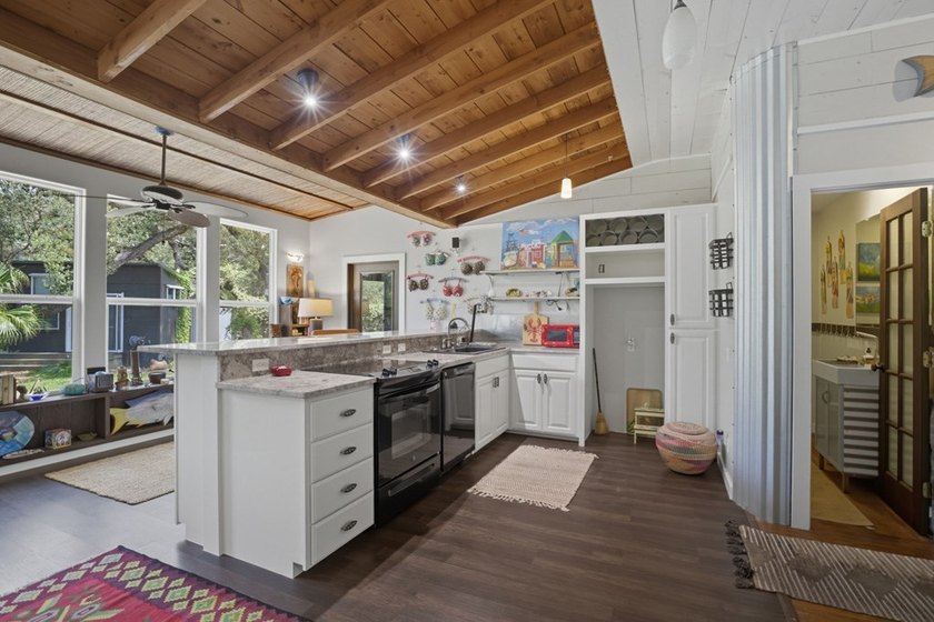 This one-of-a-kind coastal retreat blends island-style charm - photo 4