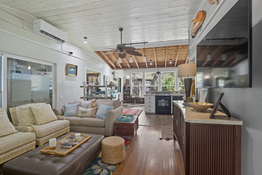 This one-of-a-kind coastal retreat blends island-style charm - photo 7