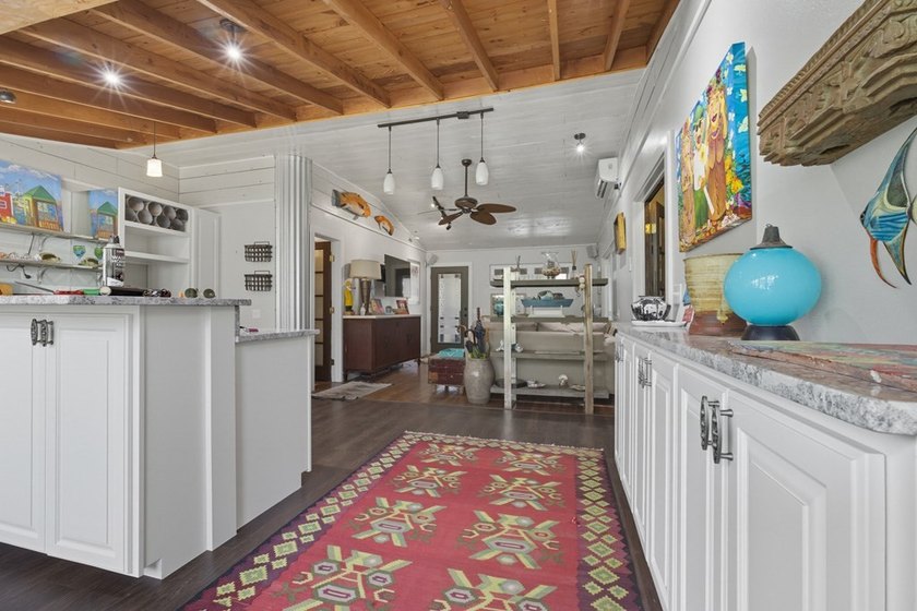 This one-of-a-kind coastal retreat blends island-style charm - photo 10