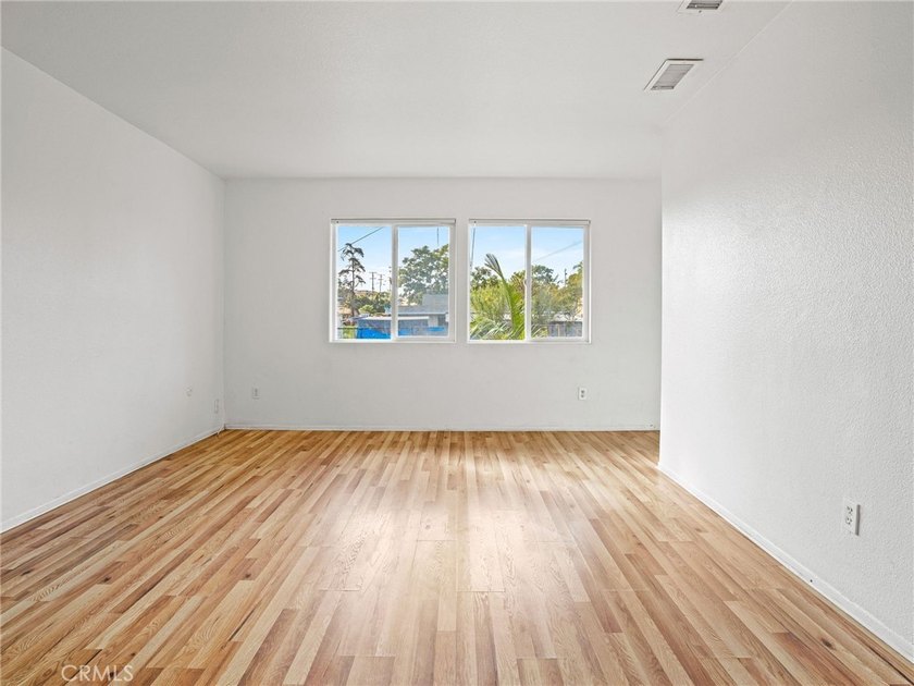 This beautifully updated 4-bedroom, 2-bathroom home with a 2-car - photo 6