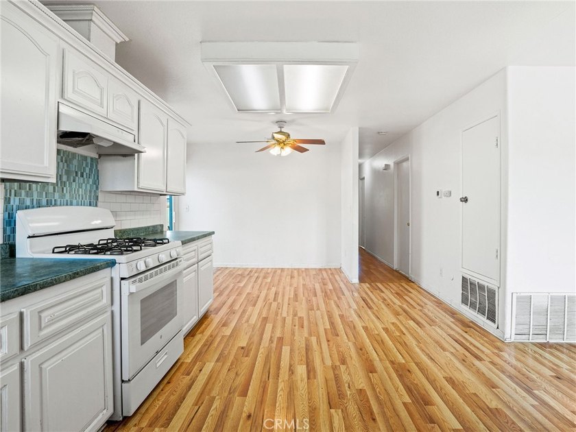 This beautifully updated 4-bedroom, 2-bathroom home with a 2-car - photo 10