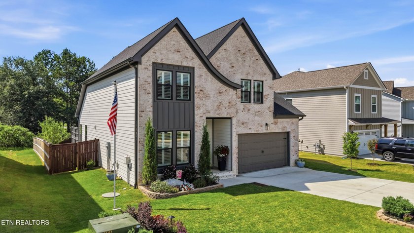 Welcome home to this beautifully designed five bedroom, two and - photo 2