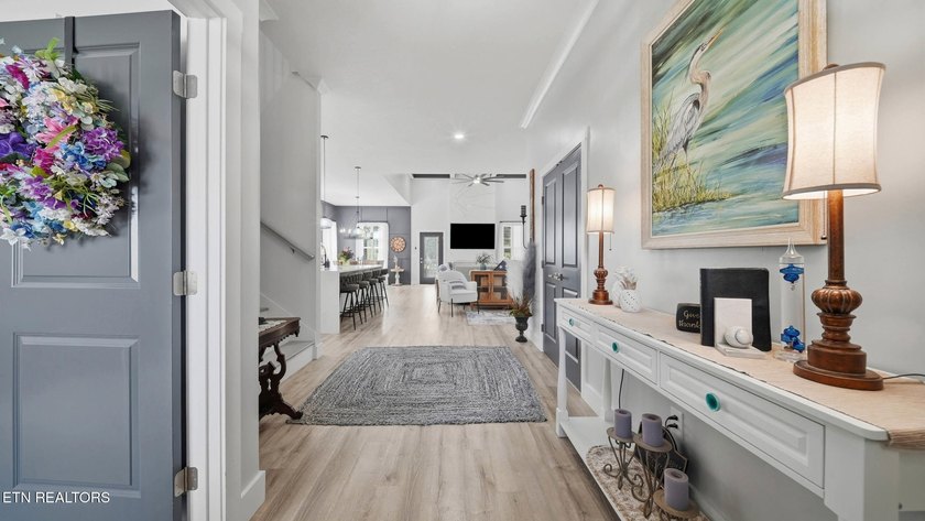 Welcome home to this beautifully designed five bedroom, two and - photo 3
