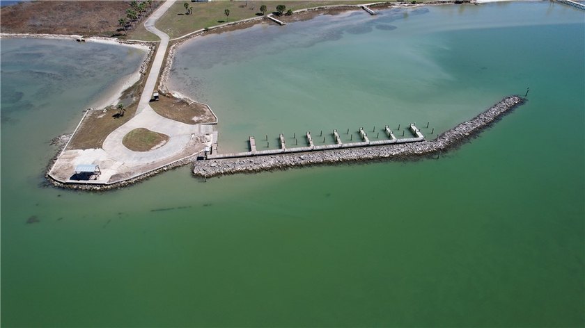 The Landing at Redfish Point is a gated coastal enclave where - photo 11