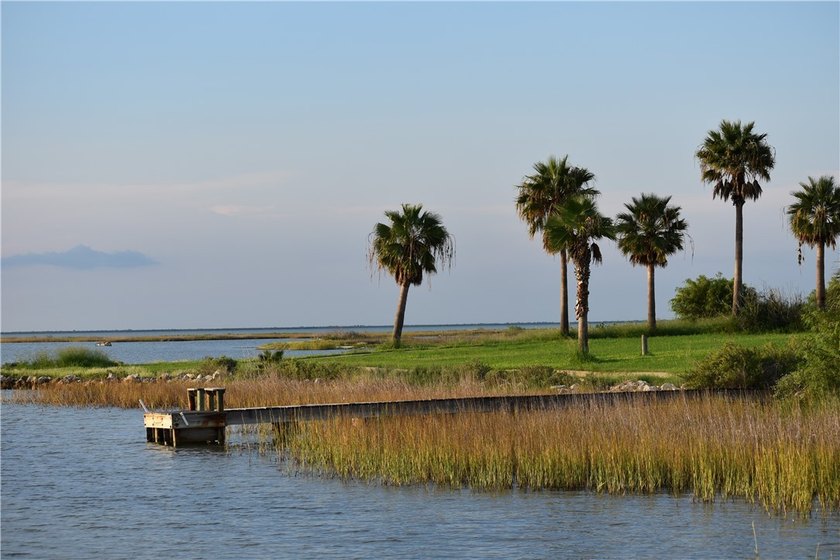 The Landing at Redfish Point is a gated coastal enclave where - photo 12
