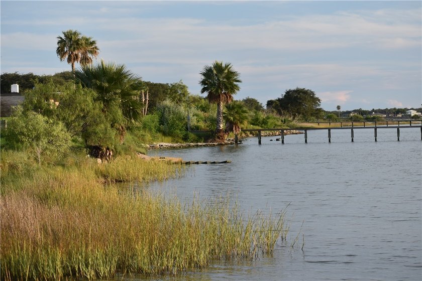 The Landing at Redfish Point is a gated coastal enclave where - photo 13