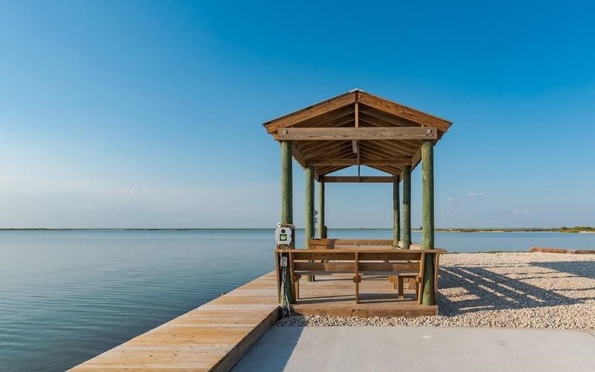 The Landing at Redfish Point is a gated coastal enclave where - photo 14