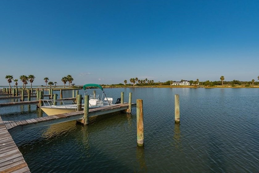 The Landing at Redfish Point is a gated coastal enclave where - photo 17