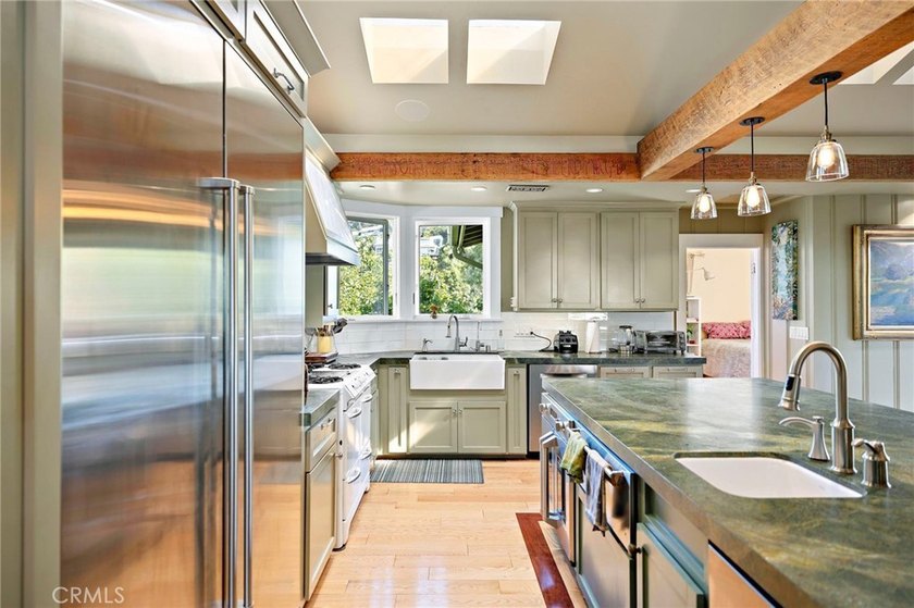 This beautifully maintained 4-bedroom, 3-bath home captures the - photo 6