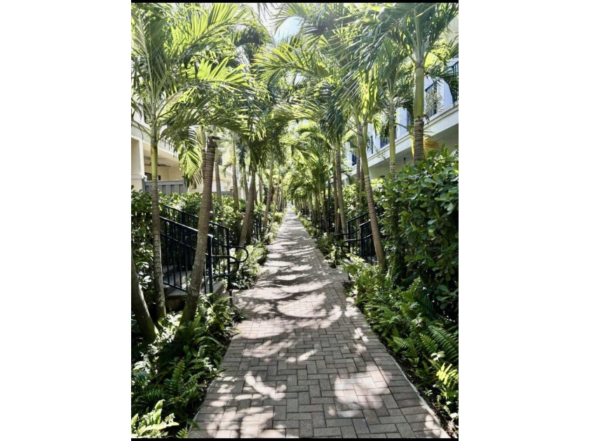 Welcome to this stunning tri-level Mediterranean-style townhome - photo 5