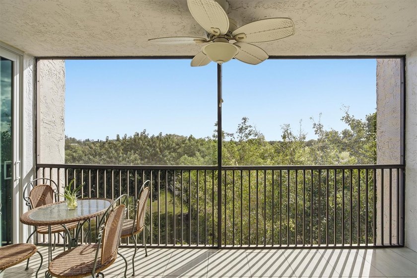 This spacious 3-bedroom, 2.5-bath corner unit in the gated *18th - photo 2