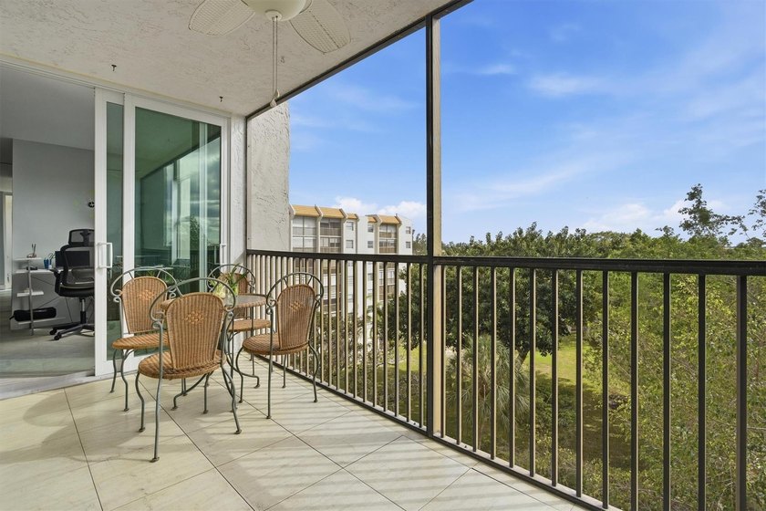 This spacious 3-bedroom, 2.5-bath corner unit in the gated *18th - photo 4