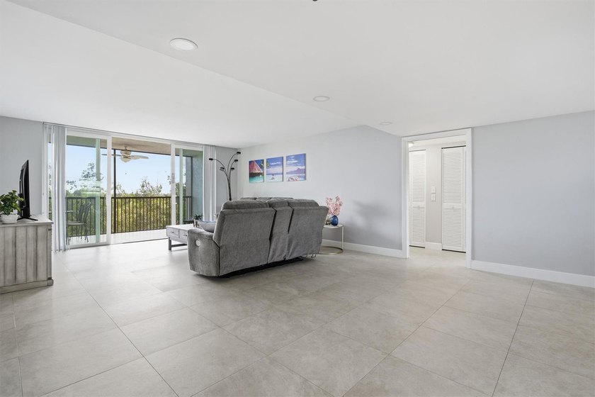 This spacious 3-bedroom, 2.5-bath corner unit in the gated *18th - photo 5