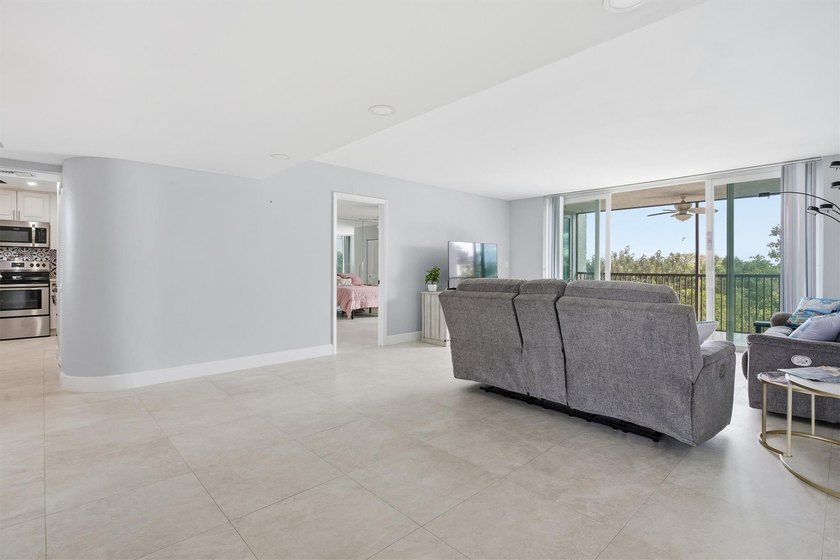 This spacious 3-bedroom, 2.5-bath corner unit in the gated *18th - photo 6