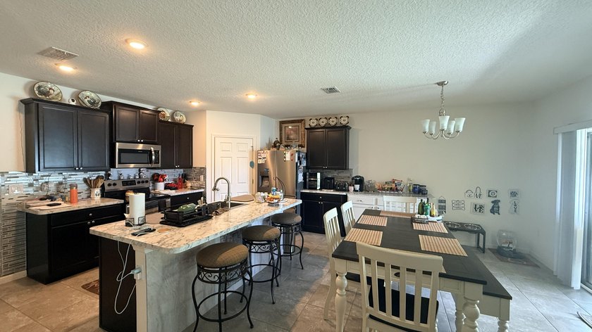 Welcome to this charming 4-bedroom, 2-bathroom home located in - photo 5