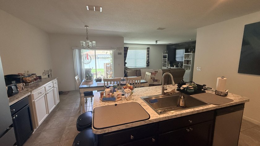 Welcome to this charming 4-bedroom, 2-bathroom home located in - photo 6