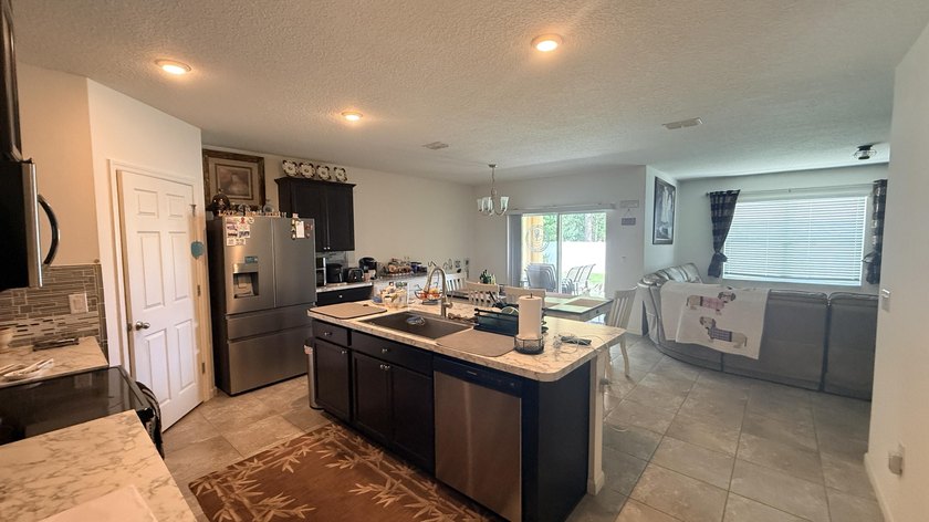 Welcome to this charming 4-bedroom, 2-bathroom home located in - photo 8