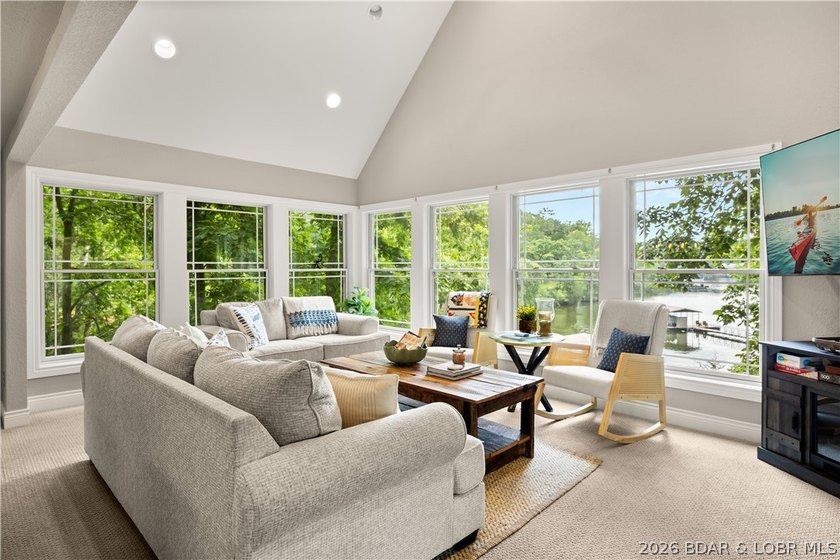 Discover peace and tranquility in this stunning lakefront home - photo 13