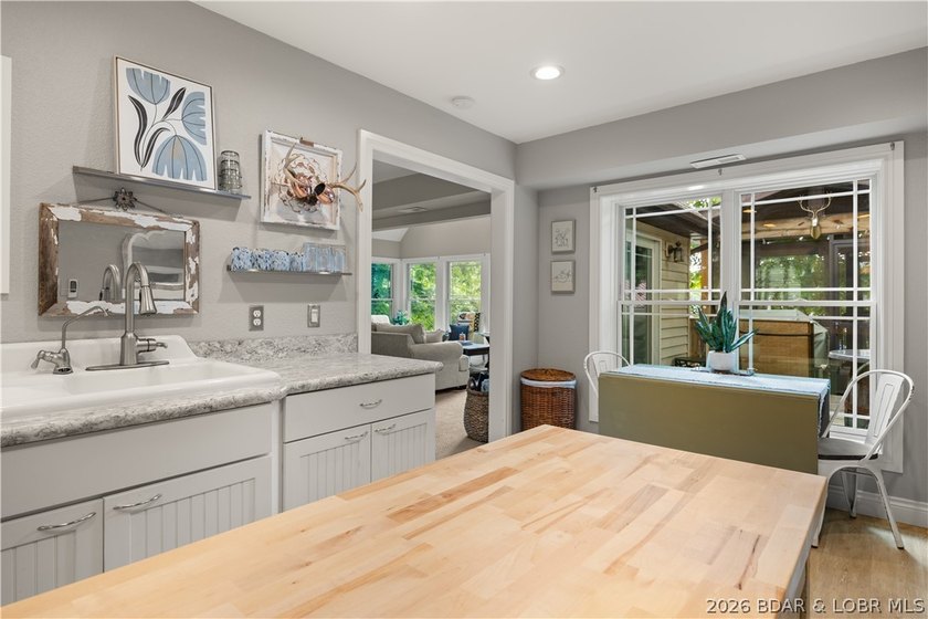 Discover peace and tranquility in this stunning lakefront home - photo 19