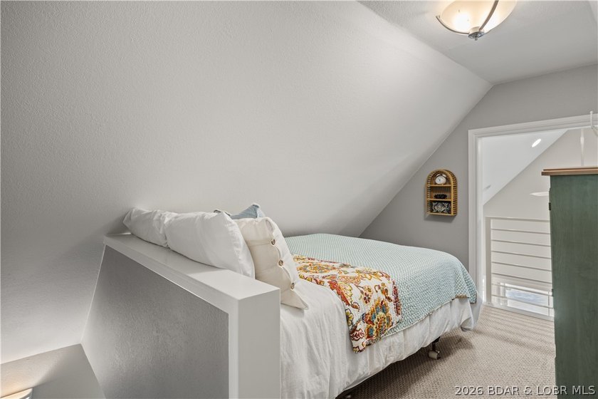 Discover peace and tranquility in this stunning lakefront home - photo 21