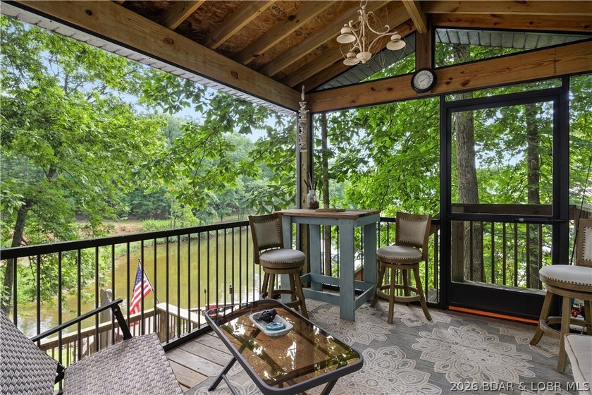 Discover peace and tranquility in this stunning lakefront home - photo 33