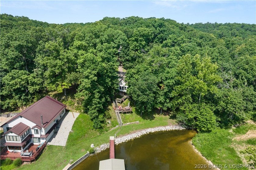 Discover peace and tranquility in this stunning lakefront home - photo 45