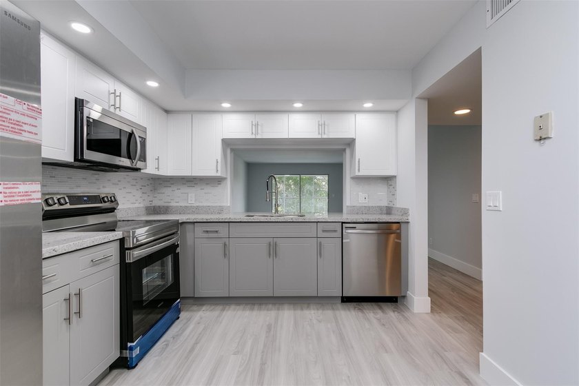 Updated 2 bedroom, 2 bath condo in Century Village in excellent - photo 5