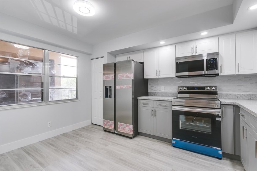 Updated 2 bedroom, 2 bath condo in Century Village in excellent - photo 6