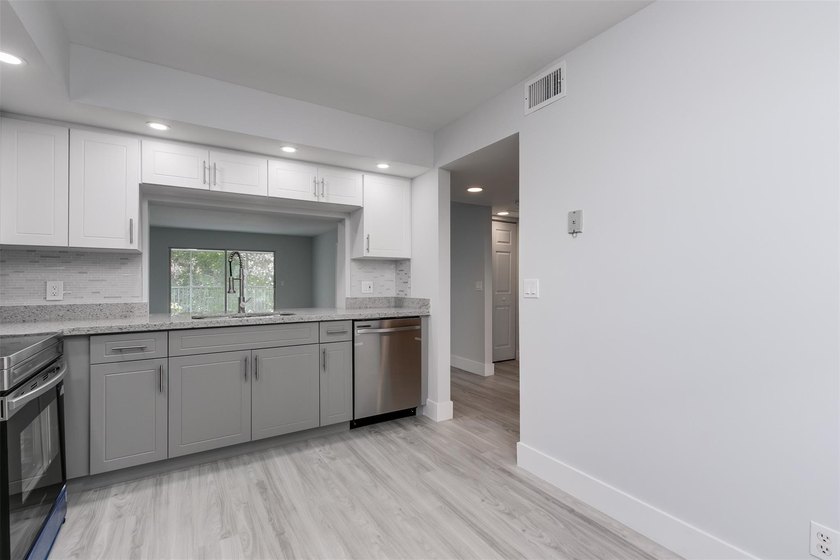 Updated 2 bedroom, 2 bath condo in Century Village in excellent - photo 7