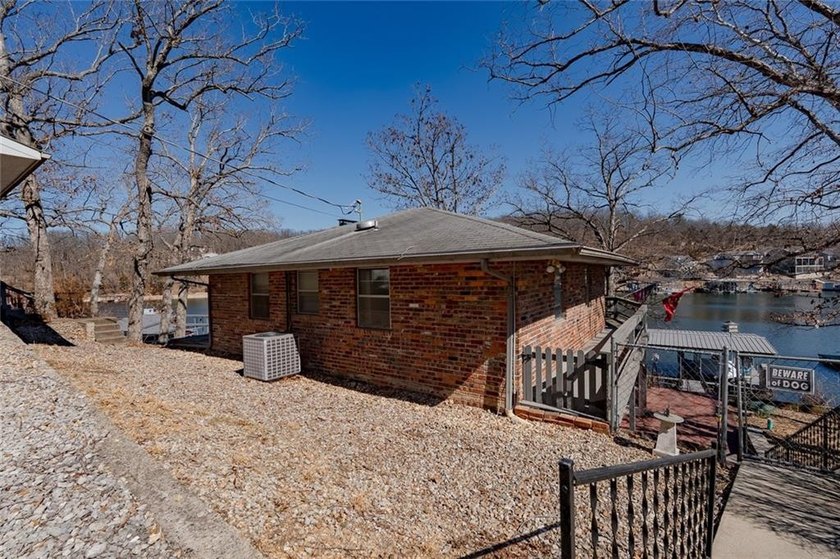 Nestled at the 8 MM in Buck Creek Cove, this lakefront retreat - photo 34