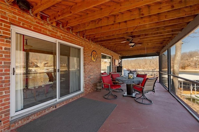 Nestled at the 8 MM in Buck Creek Cove, this lakefront retreat - photo 37