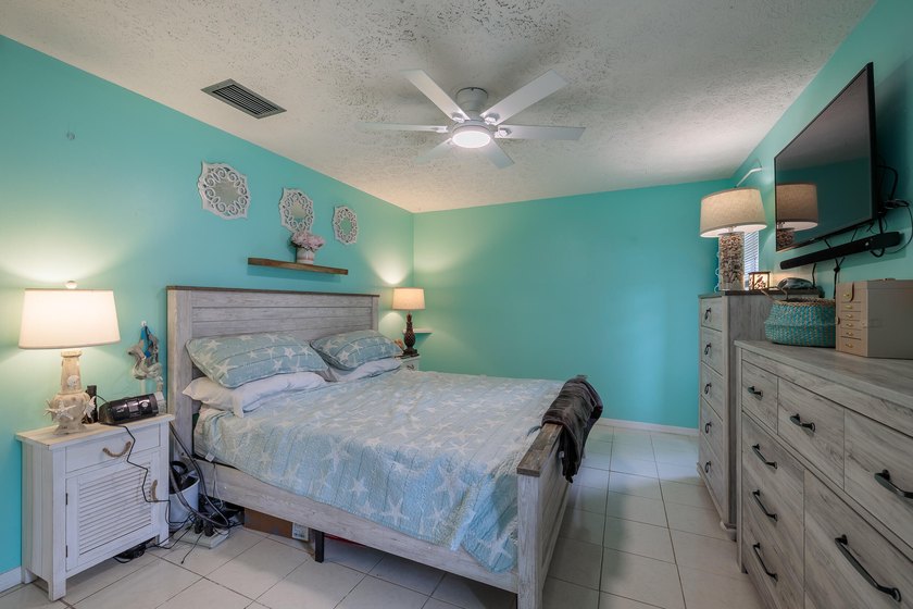 Welcome to this charming 2-bedroom, 2-bath pool home in the - photo 12