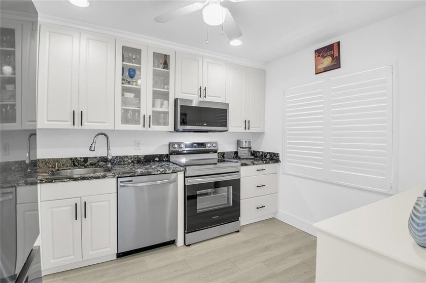 FURNISHED LAKEFRONT CORNER UNIT CONDO in the desirable Cypresses - photo 13
