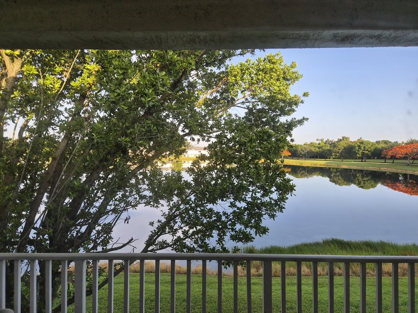 Welcome to this WATERFRONT END UNIT TOWNHOME in Emerald Lakes of - photo 2