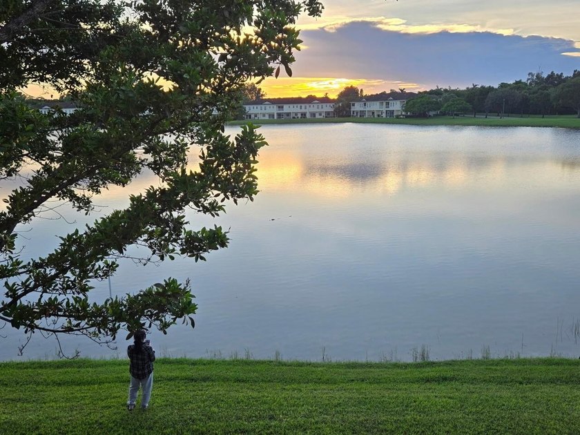 Welcome to this WATERFRONT END UNIT TOWNHOME in Emerald Lakes of - photo 3