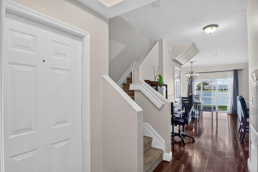 Welcome to this WATERFRONT END UNIT TOWNHOME in Emerald Lakes of - photo 8