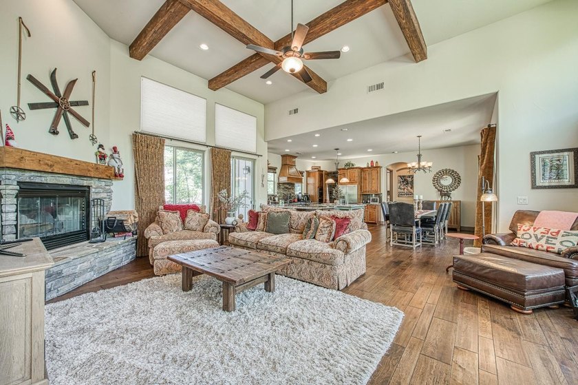 Nestled in the prestigious Bretz Mountain community, this - photo 2