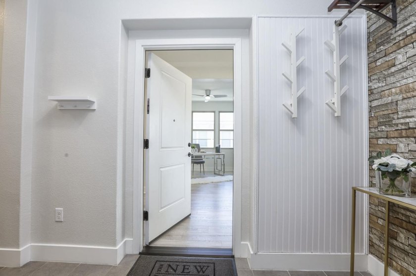 Welcome to 1089 Dewberry Place #401, a stunning top-floor corner - photo 2