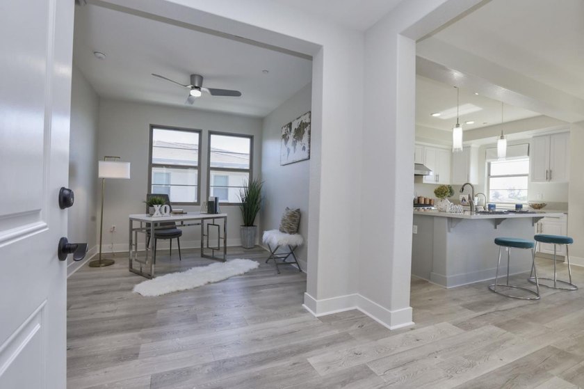 Welcome to 1089 Dewberry Place #401, a stunning top-floor corner - photo 3