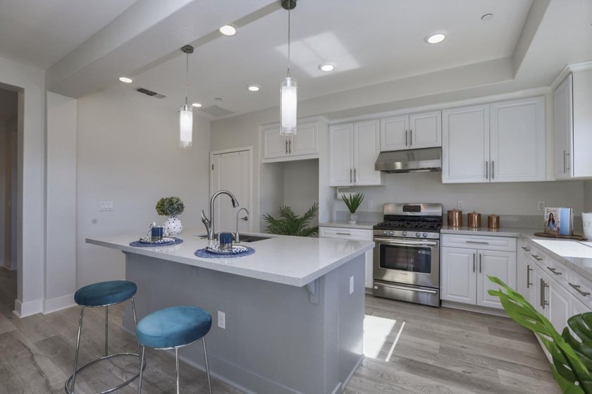 Welcome to 1089 Dewberry Place #401, a stunning top-floor corner - photo 9