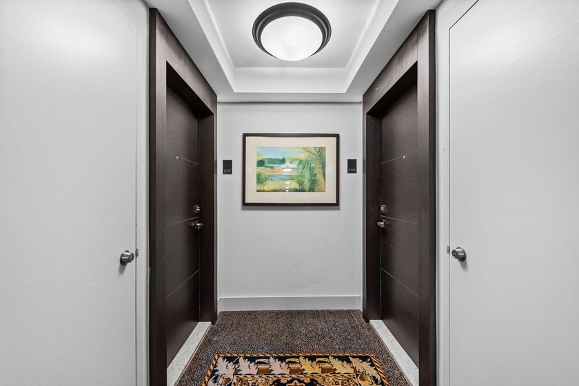 Stunning top-floor corner unit offering breathtaking wraparound - photo 14
