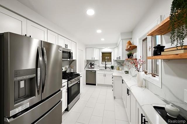 Welcome home to this beautifully updated three-bedroom, two - photo 17