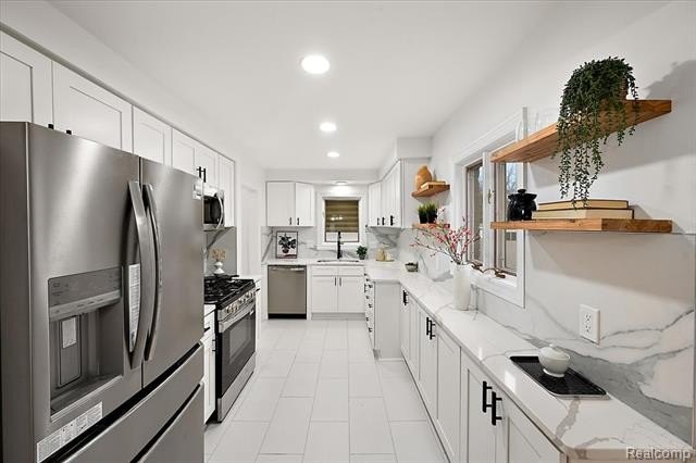 Welcome home to this beautifully updated three-bedroom, two - photo 20