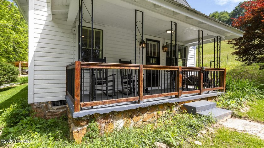Discover a rare opportunity to own a charming 1940s mountain - photo 14