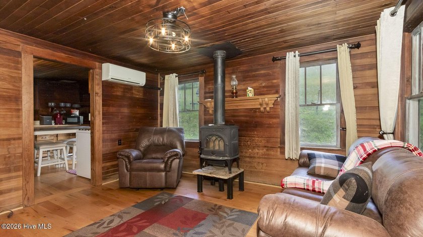 Discover a rare opportunity to own a charming 1940s mountain - photo 25