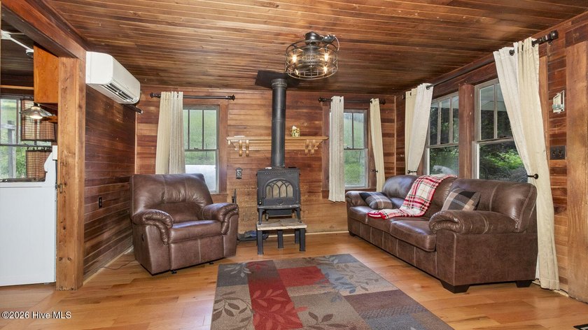Discover a rare opportunity to own a charming 1940s mountain - photo 26