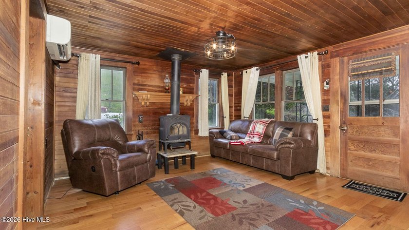 Discover a rare opportunity to own a charming 1940s mountain - photo 27