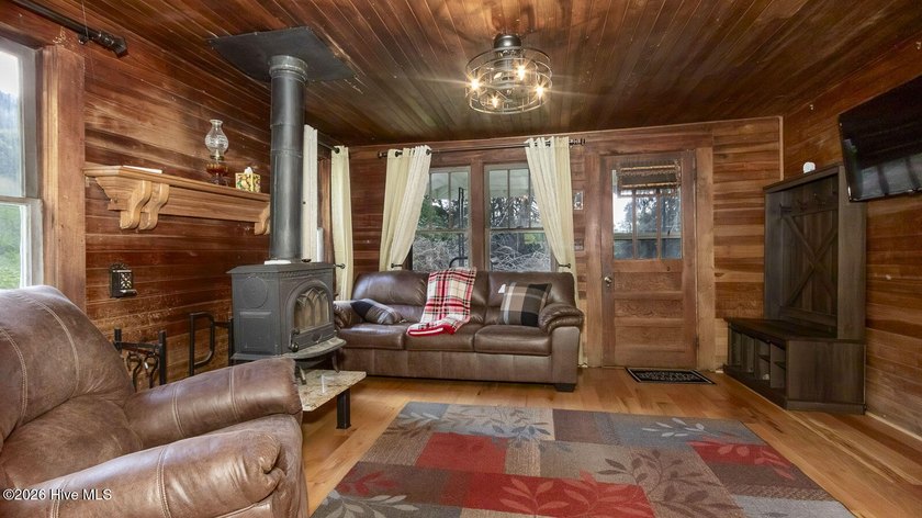 Discover a rare opportunity to own a charming 1940s mountain - photo 28