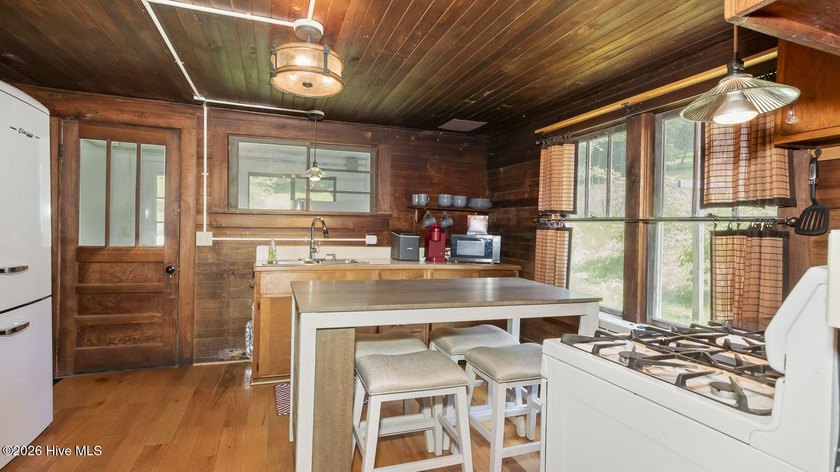 Discover a rare opportunity to own a charming 1940s mountain - photo 33