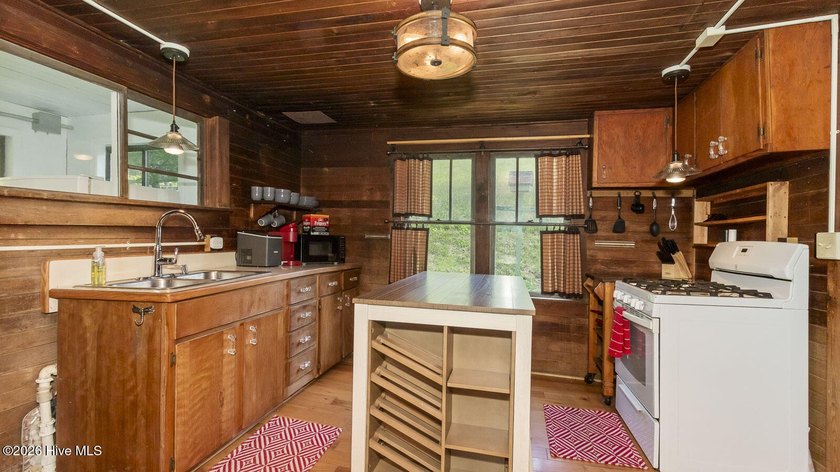 Discover a rare opportunity to own a charming 1940s mountain - photo 34
